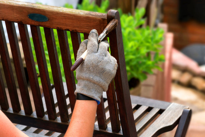 Treating wooden furniture with preservative