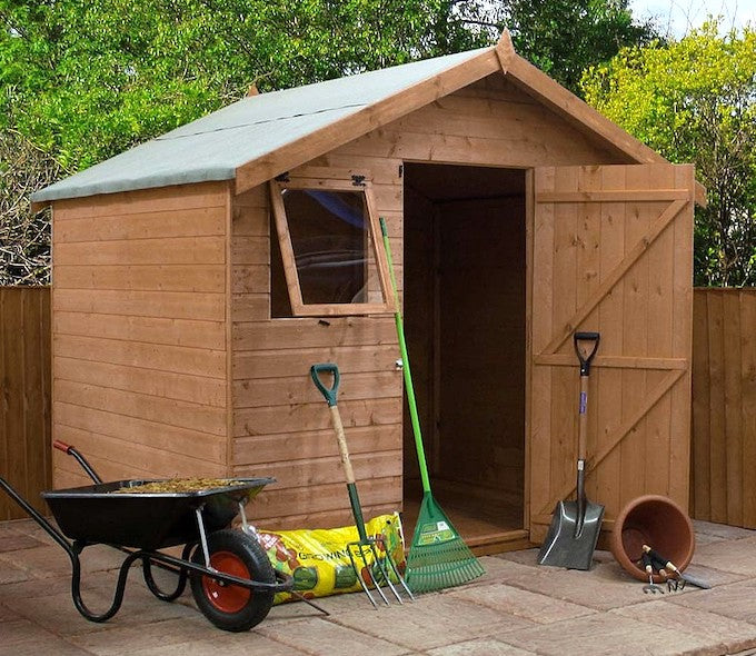 Waltons 6x8 shed with tools outside of the building