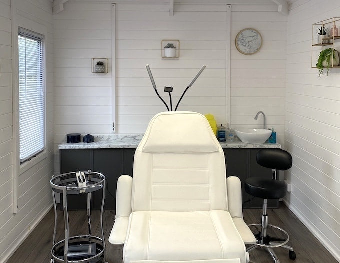 Overview of log cabin turned microblading beauty salon