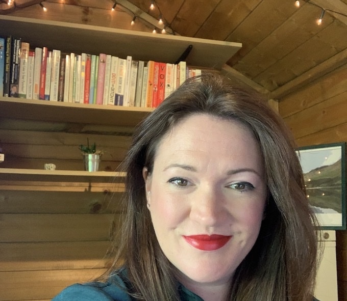 Woman sitting in her 'shedquarters' home office