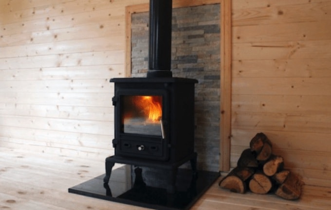 Wood burner in log cabin