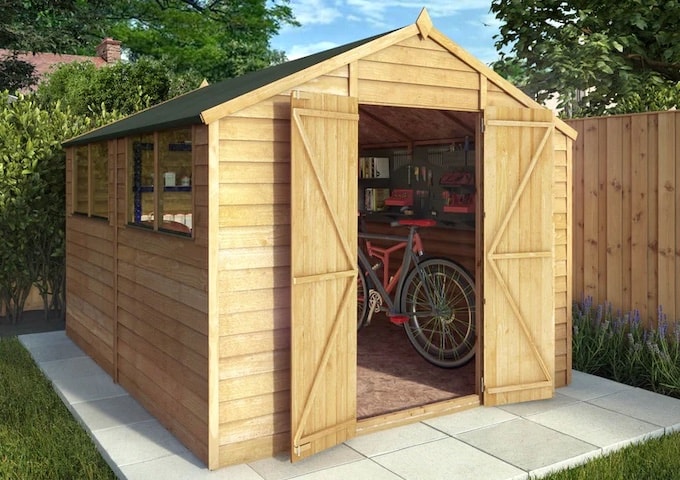 Wooden shed with open double doors and bikes