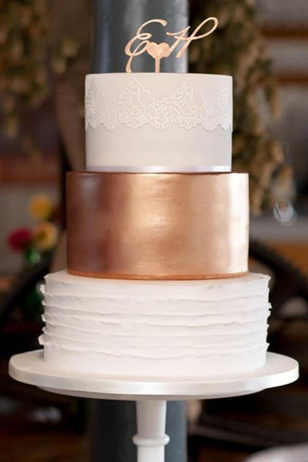 Get inspired by a rose gold wedding cake with delicate white lace detail, perfect for a intimate simple wedding.