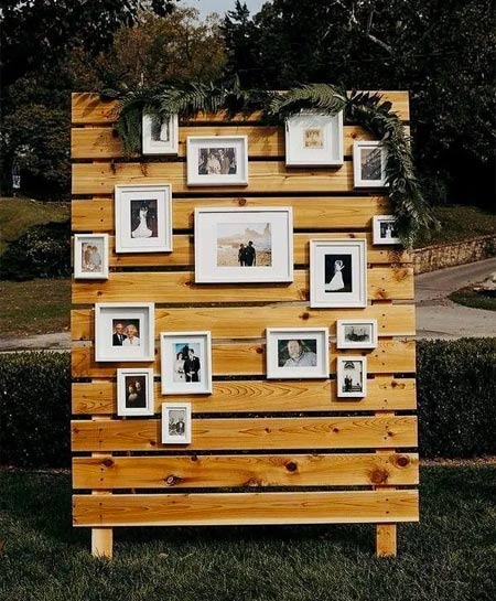 Stack white crates filled with black and white photos of the newlyweds, eucalyptus, and lanterns for a personal décor 