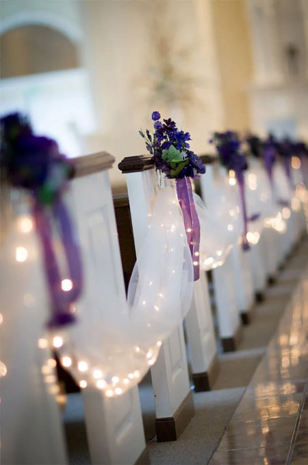 Purple Wedding Chair Decorations with Drape and String Lights