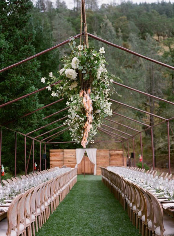 hang string lights and greenery on Montana outdoor ranch wedding reception