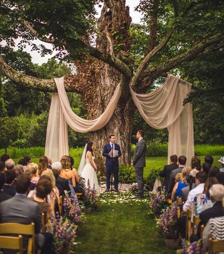 A backyard wedding ceremony space is usually a rustic, boho or casual one, sometimes more formal but seldom