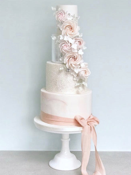 blush pink floral wedding cake with satin ribbon for elegant formal wedding