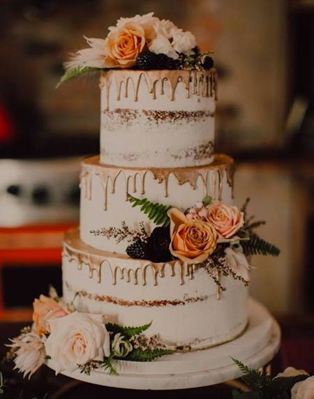 lovely and chic wedding cake decorated with rust blooms and fern is a pretty solution for a backyard fall wedding