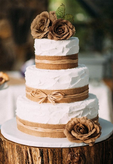 rustic burlap lace ribbon wedding cake with burlap flowers on top