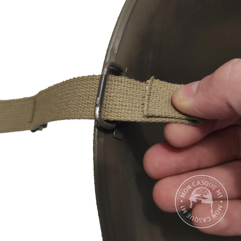 Pleat created with the US M1 helmet chinstrap around the trigger guard