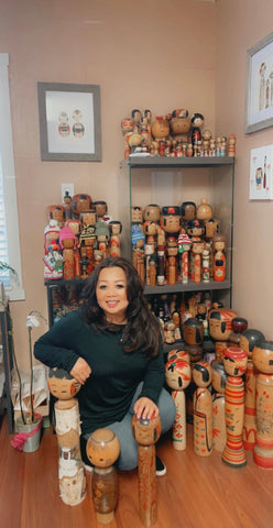 Diem with her kokeshi collection