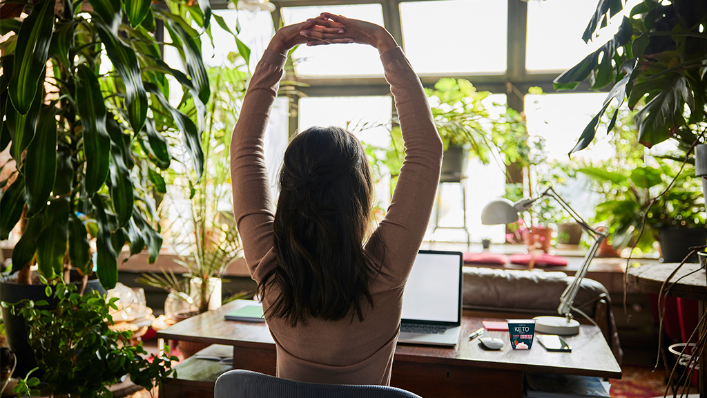 woman stretching at desk