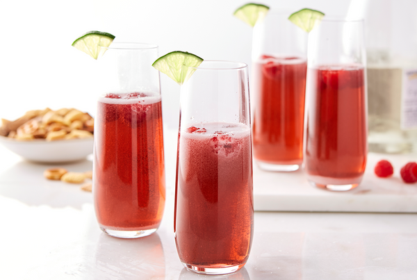 Sparkling red cocktails with lime.
