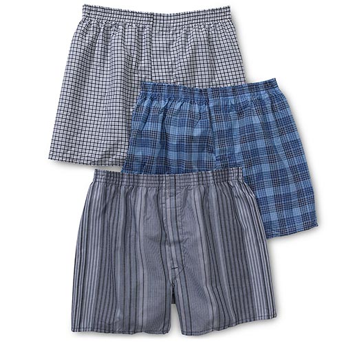 Three pairs of men's plaid boxer shorts in different colors.