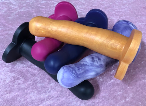 a clench of silicone dilos in different colours