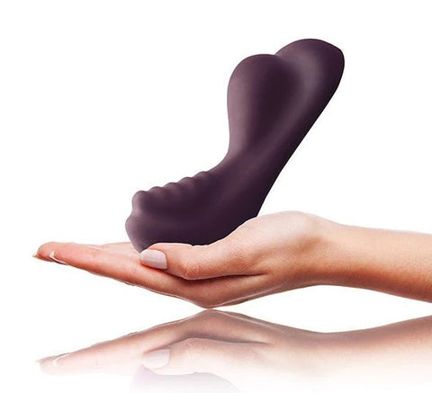 A hand holding a Ruby Glow vibrator in dark purple