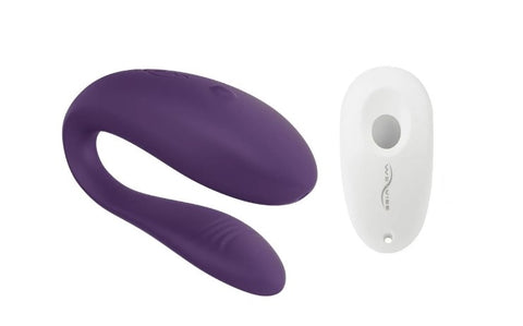 A We-Vibe Unite couples vibrator in purple with a white remote control.