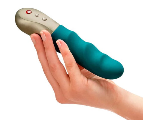 Stonic petite G-spot vibe in turquise, resting in a hand 