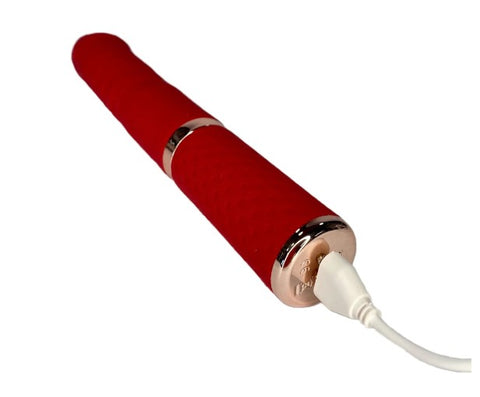 A red slim vibrator with a charging cable in white