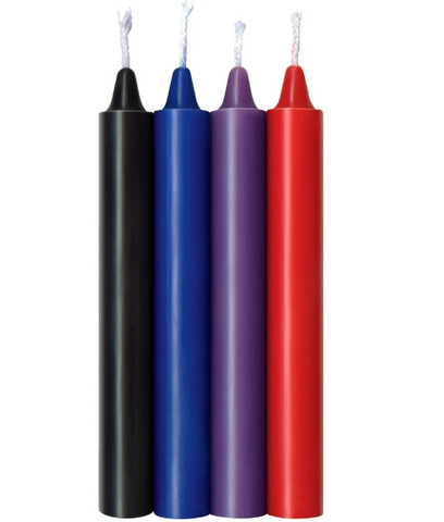 A row of four wax play candles: Black, blue, purple and red