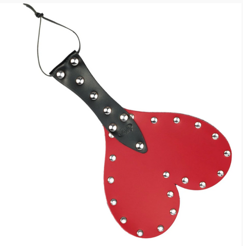 Heart-shaped paddle in red leather with a black handle 