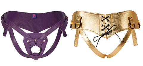 A plain-back strap-on harness in purple leather and a corset-back harness in gold