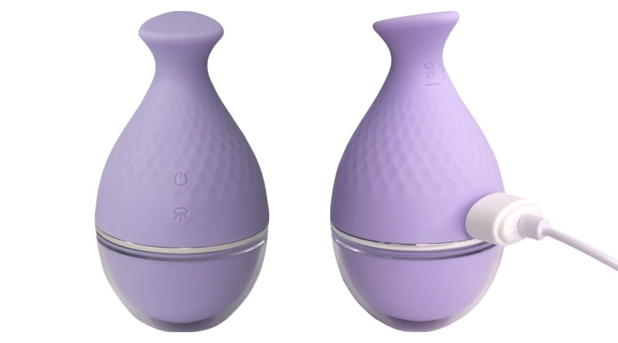 Suction sensation toy. Pale lilac round toy with triangle of silicone for easy grip and control. One toy has a USB cord attached to it.