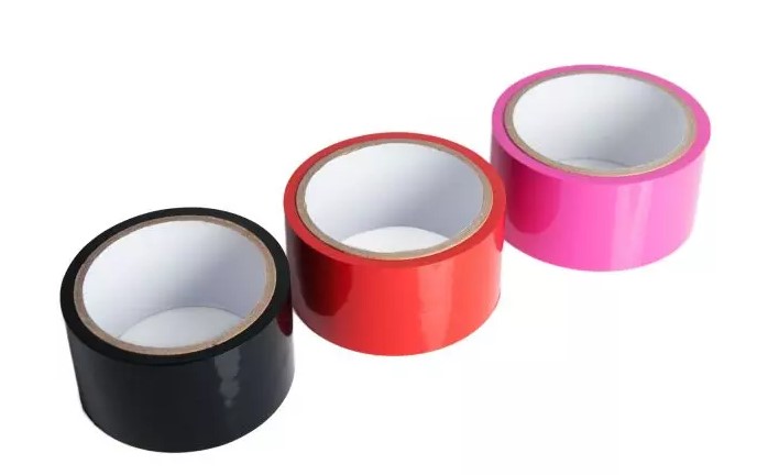3 rolls of bondage tape - black, red and pink