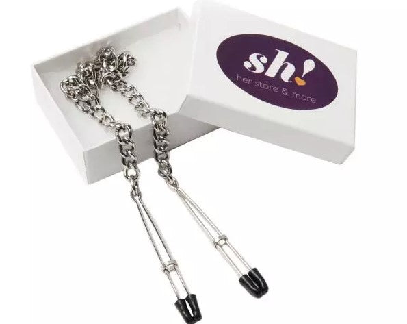 silver nipple clamps with black tips in a white box with aa Sh! logo purple sticker