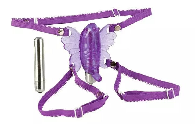 a purple venus butterfly vibrator with straps to go around the thighs. a silver bullet vibrator.