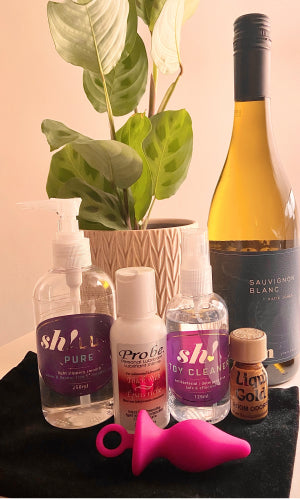 a selection of anal products and a bottle of wine