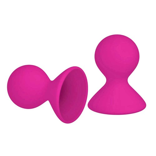 two nipple suction cups in hot pink