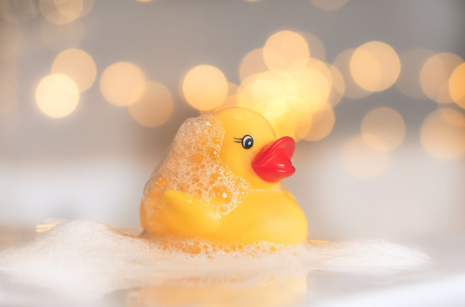 a bubble bath with a yellow duckie