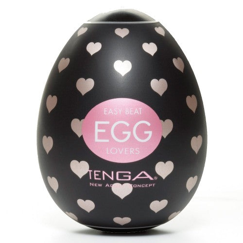 Egg shell in black plastic with tiny pale pink hearts. Tenga Egg Lovers written on teh front.