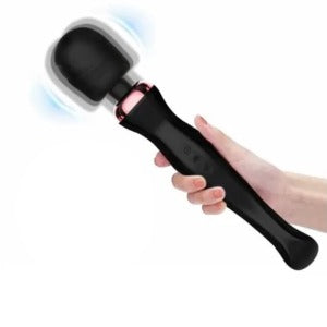 A hand holing a black Oscar wand vibrator