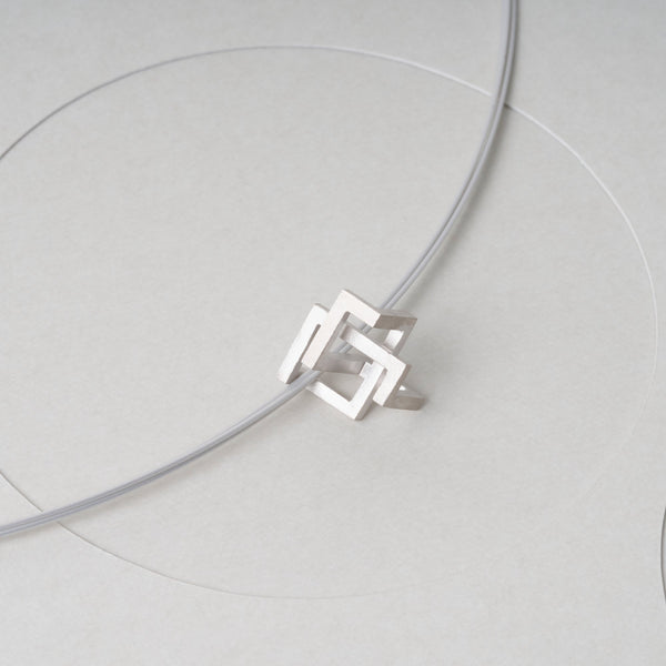 Sterling Silver 925 pendant "By-Pass". It has a modern, geometric design by japanese jewelry brand MENTOSEN.