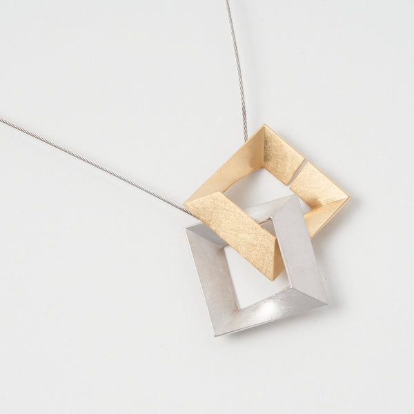 Sterling Silver 925  pendant "Log Ζ zeta". It has two connect in one and modern design. Two-tone color of silver and gold by japanese jewelry brand MENTOSEN.
