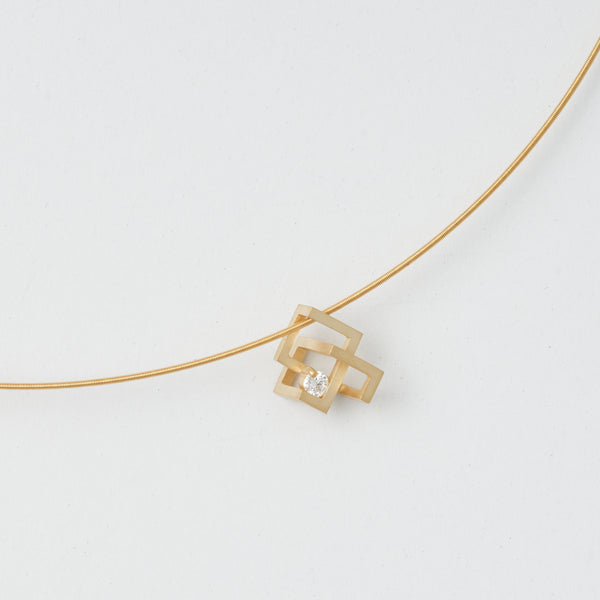 K18 diamond pendant "By-Pass". It has a modern, geometric design by japanese jewelry brand MENTOSEN.