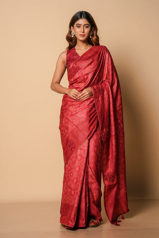 A woman wearing a dark red pure tussar printed saree