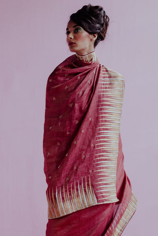 A woman wearing a rani pure tussar saree