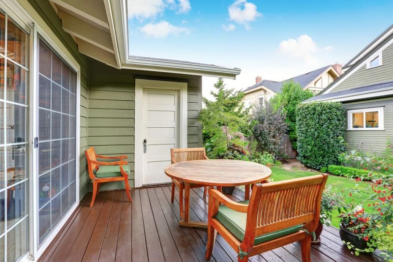 Outdoor furniture on a porch.