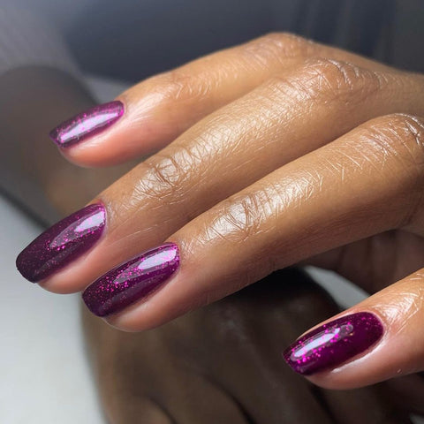 Deep purple glitter manicure