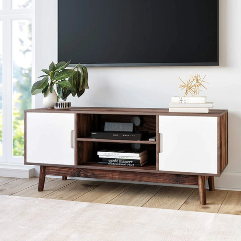 artful decor on modern mid century tv stand with trendy aesthetic 
