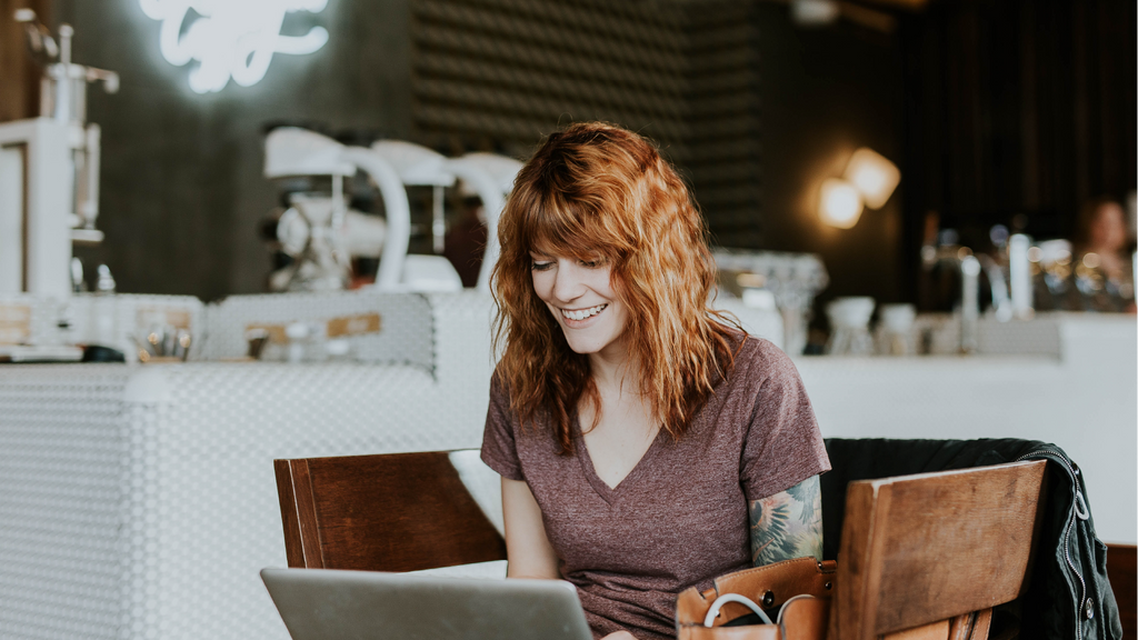 Woman getting work done after successfully managing her ADHD