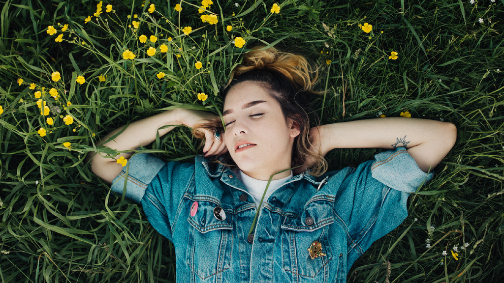 Woman sleeping in grass