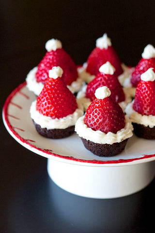 Image features a plate with Strawberries on top of brownies that are shaped to look like christmas trees - Giddy Vibes