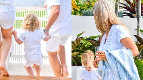 A family walking togather outside with Christmas pyjamas on