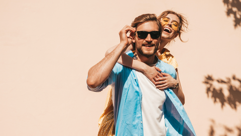 Woman and man wearing sunglasses