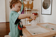 child engaged in sensory play